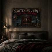 The Pier Bell Rings landscape canvas depicting a brass bell in an empty seaside booth, shown in a moody bedroom above a bed.