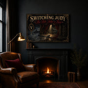 The Tide Takes a Bow landscape canvas depicting an empty seaside stage and discarded mask, shown in a dark reading nook above a fireplace.